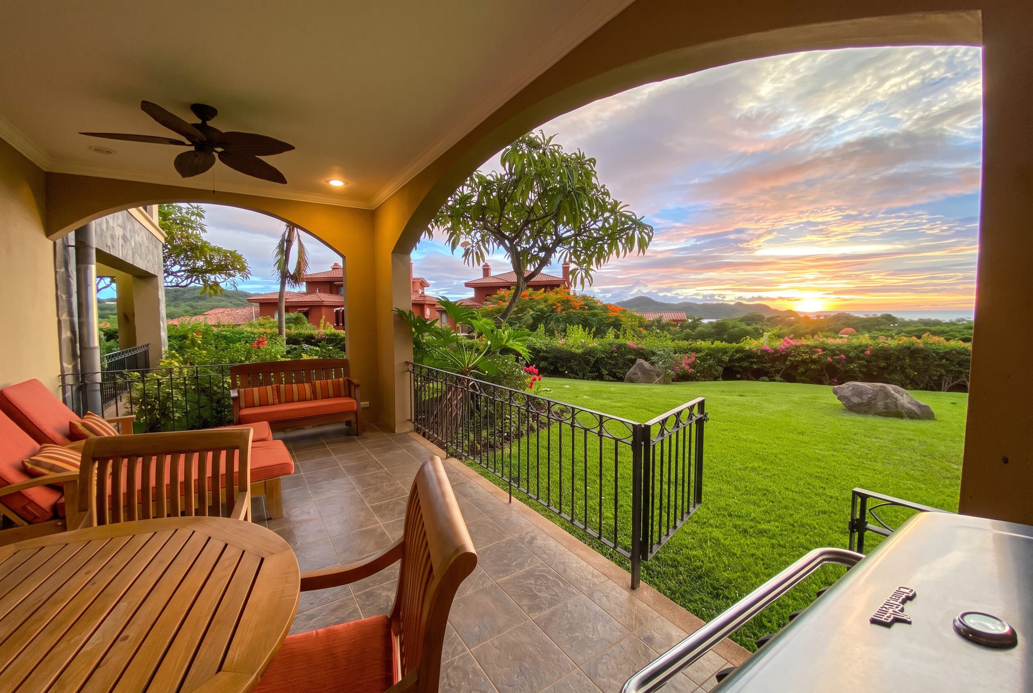 The covered terrace at sunset, looking over the lawn